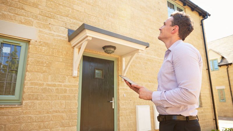 Agent checking out a home